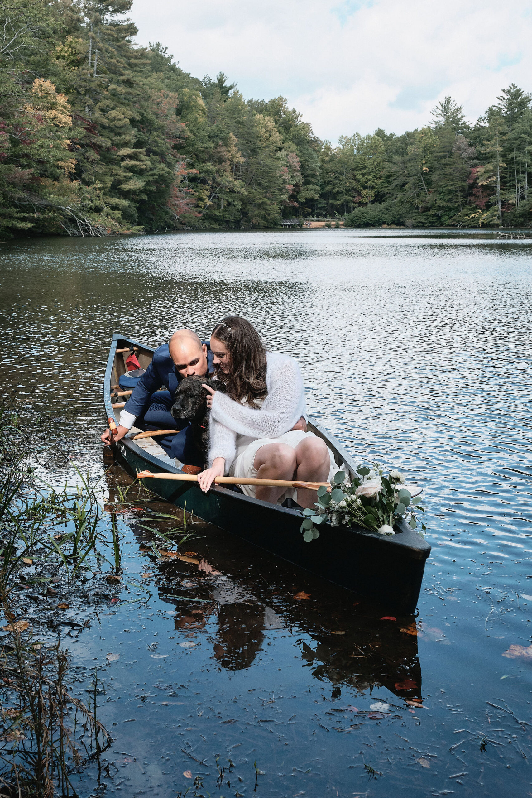 Eloping couple chooses to do what they love and canoe on their wedding day.