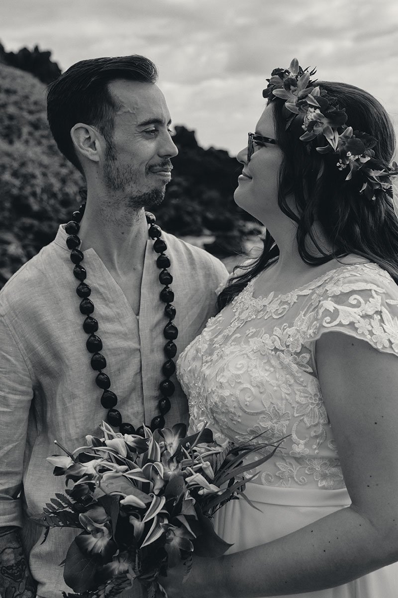 Elopement Couple gazing toward each other in Hawaii