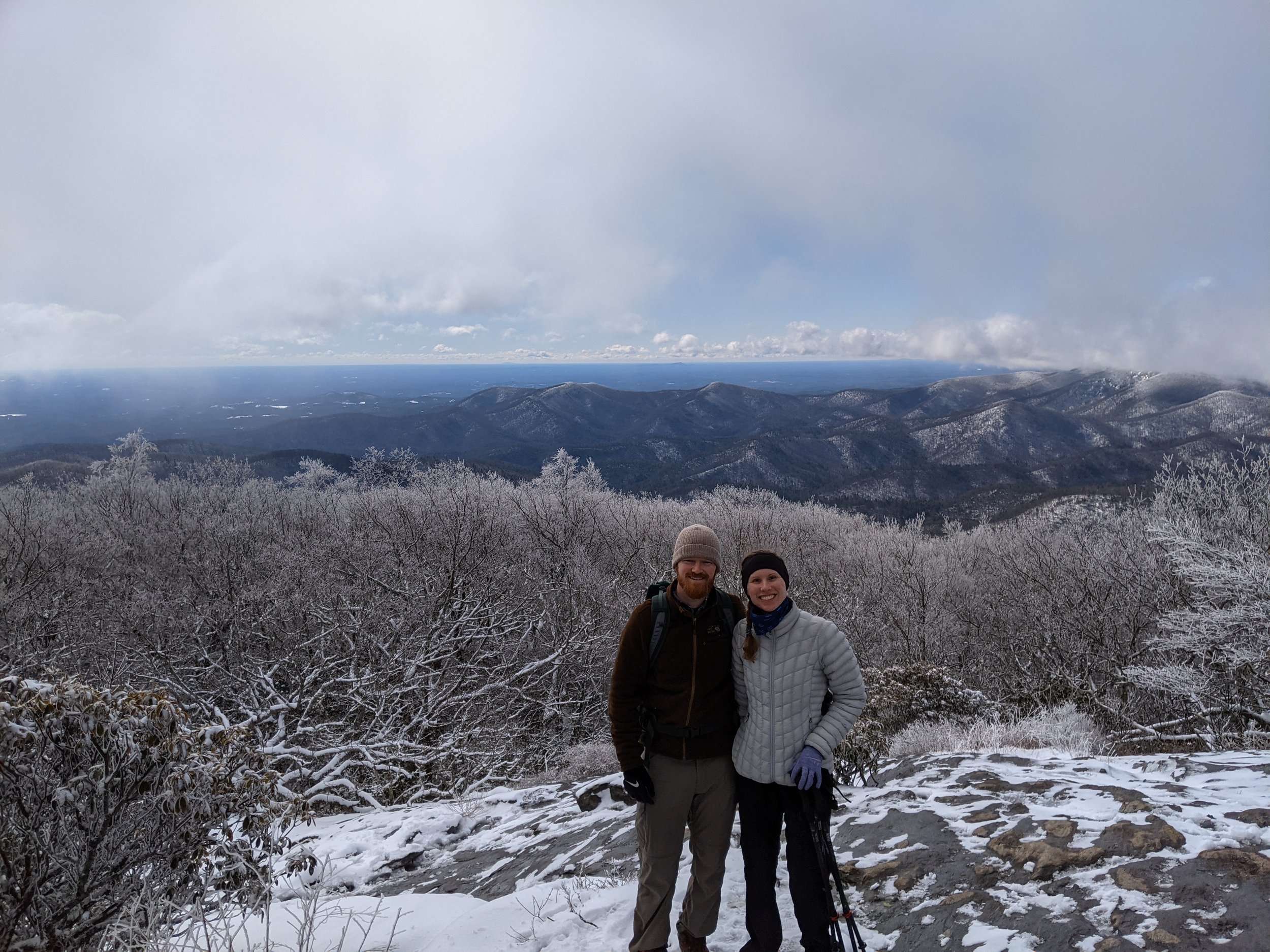 Couple Hiking atop Blood Mountain in the snow