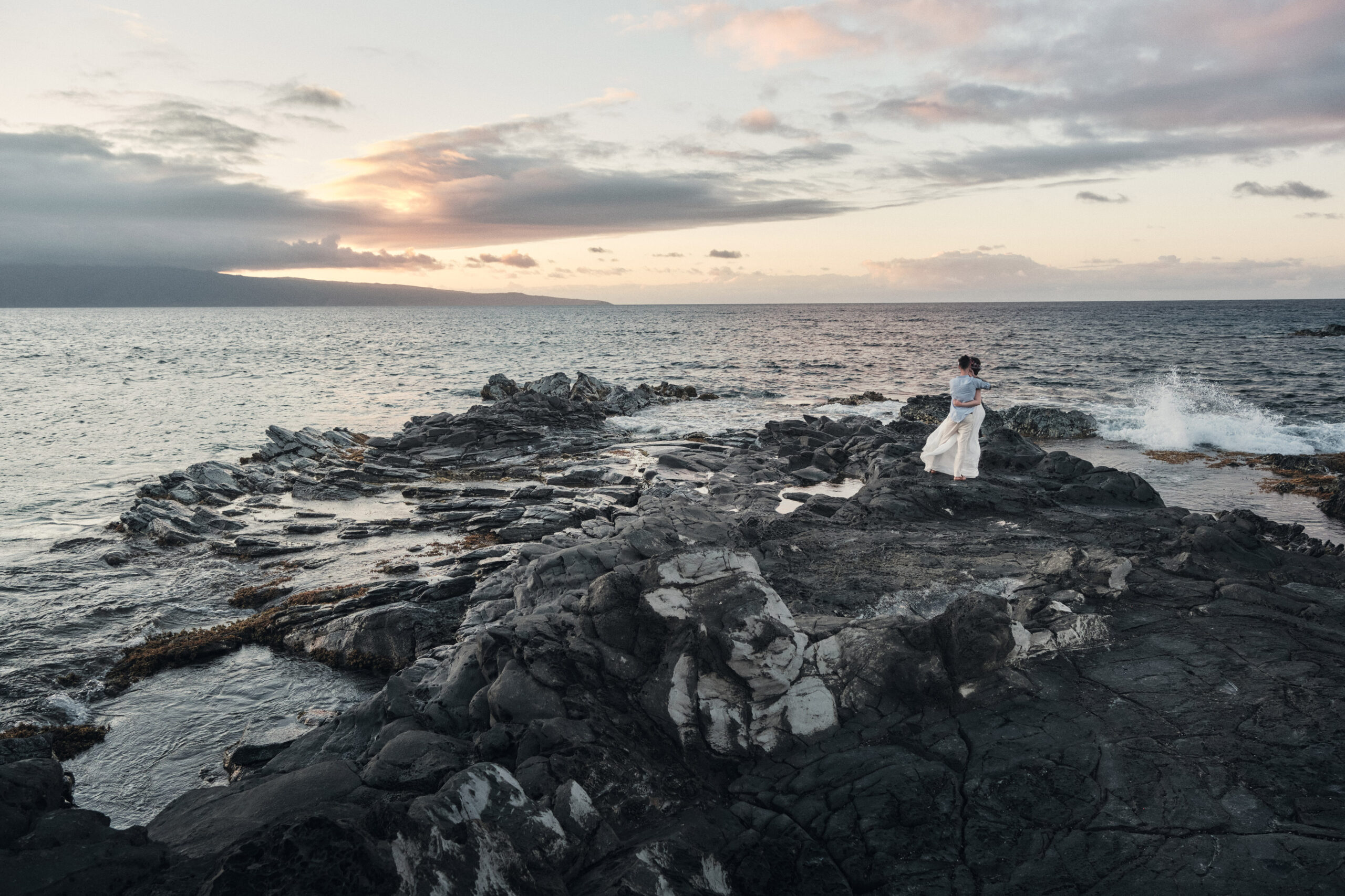 Couple eloping on the cliffs of Hawaii.