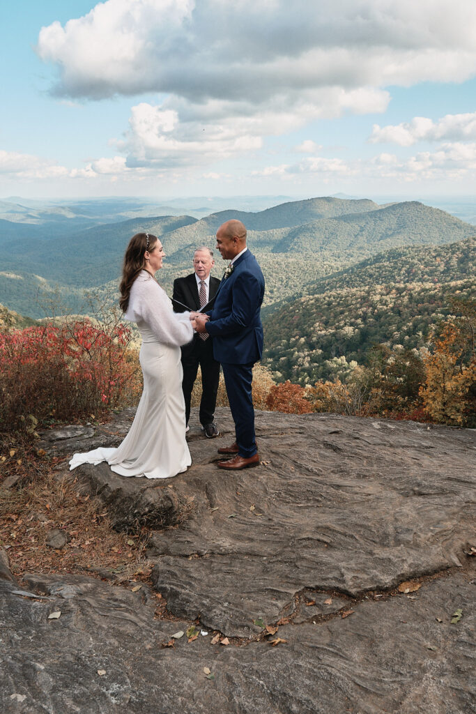 Couple holding hands during an elopement ceremony