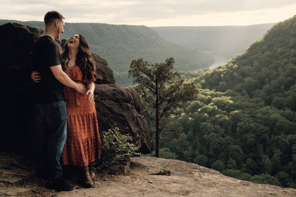 Eloping couple laughing at sunset in Chattanooga Tennessee.