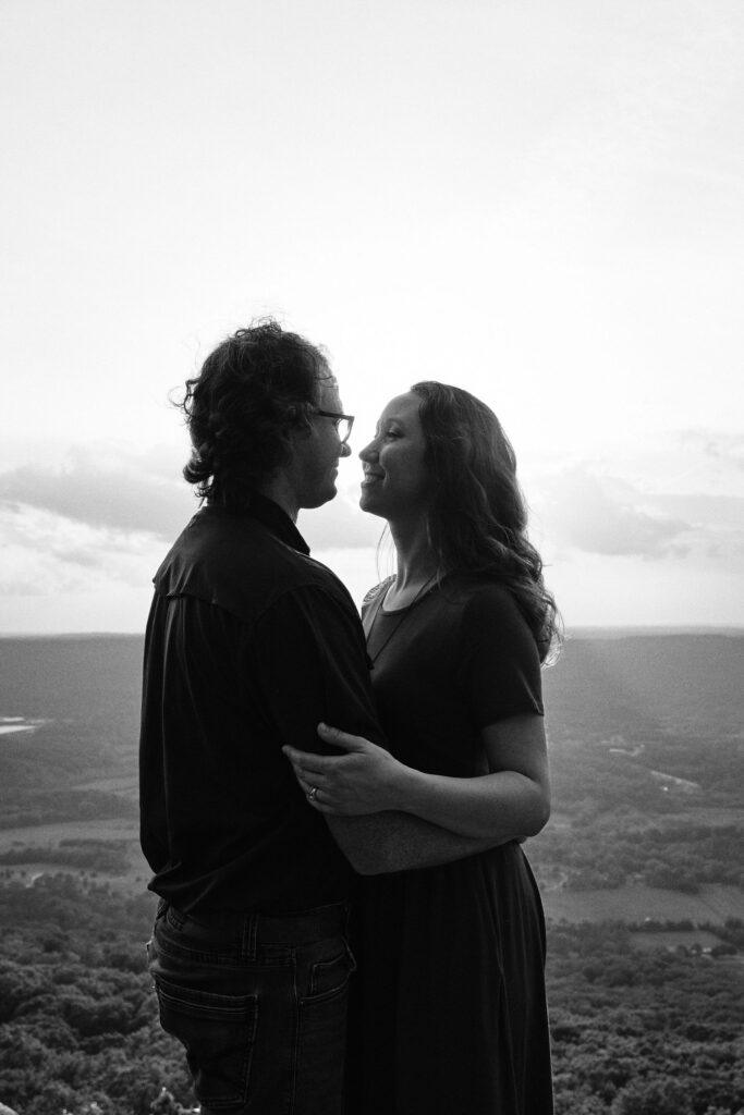 Couple looking deep into each others eyes overlooking the Tennessee Valley.