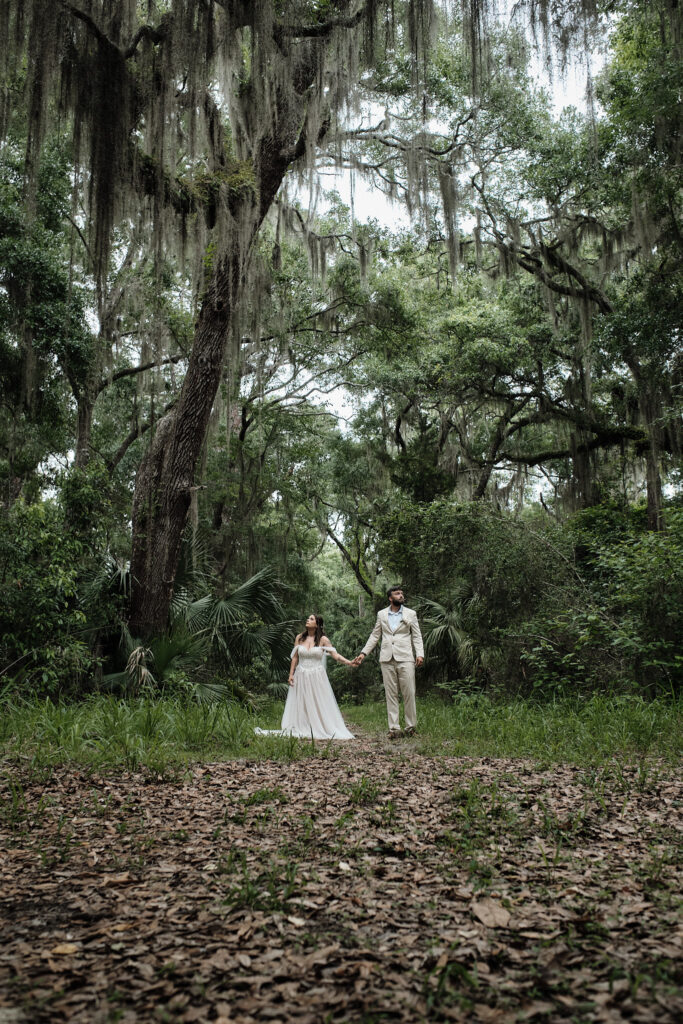 Eloping couple stares out at the beauty of Jekyll Island forests 