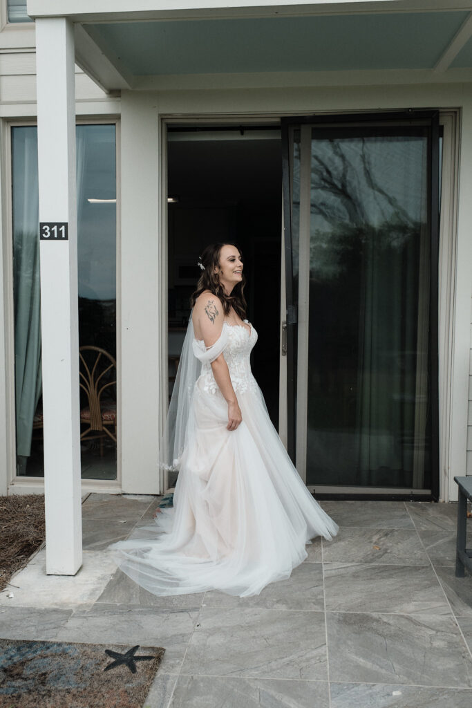 Bride smiling and twirling in her wedding dress