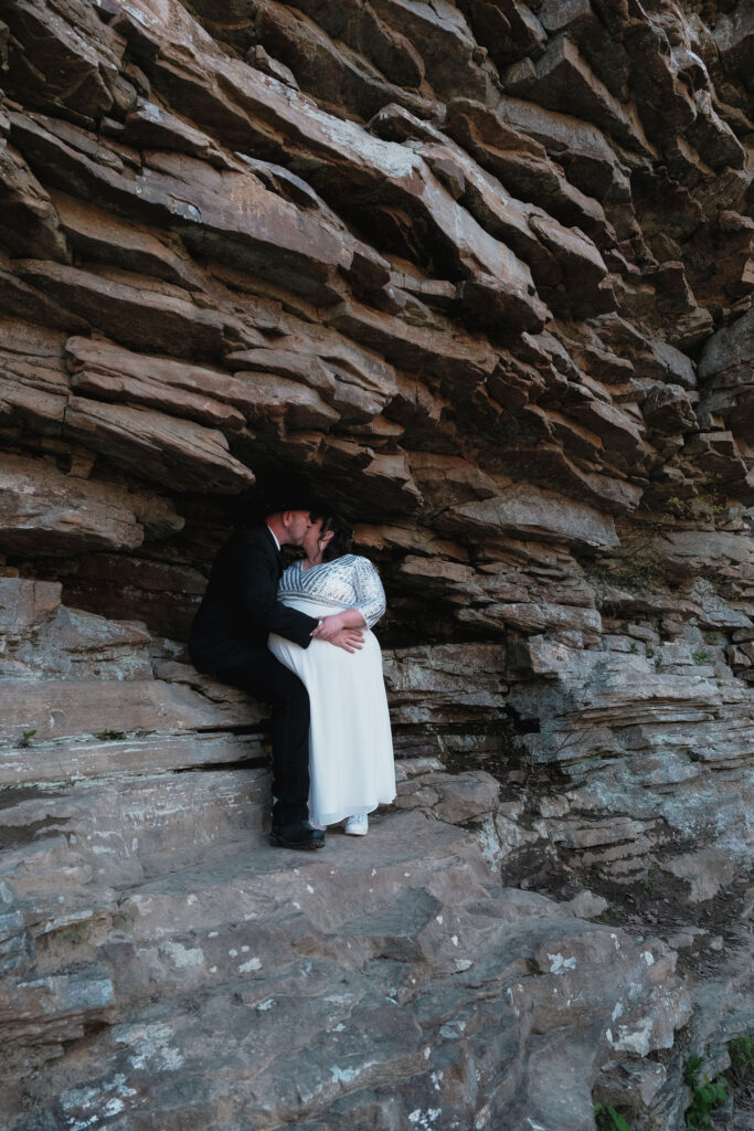 Couple kissing within the rock formations at Cloudland Canyon