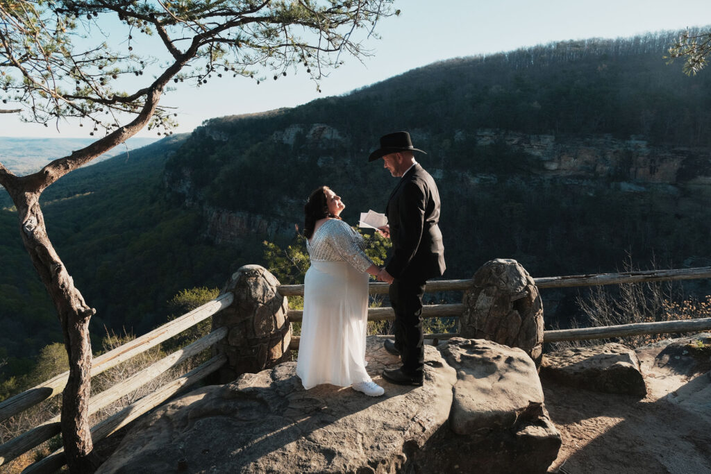 Couple exchanging vows on their wedding day at the main Cloudland Canyon Overlook