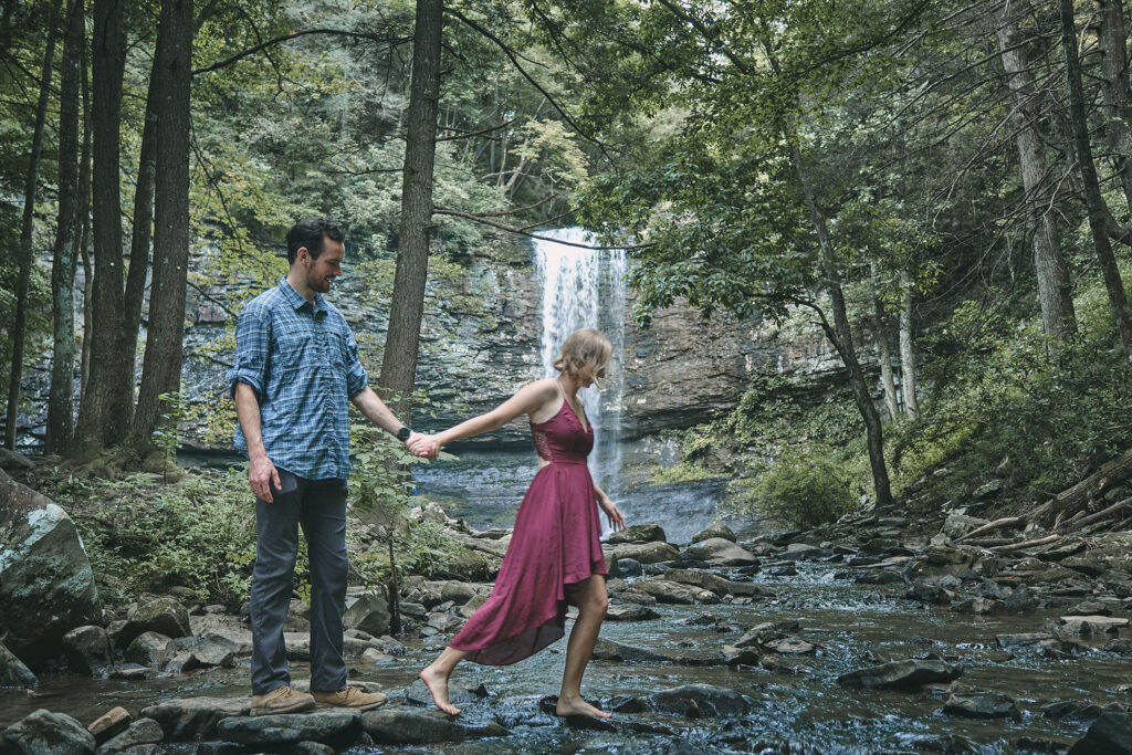 Couple walking in the creek on their Cloudland Canyon elopement