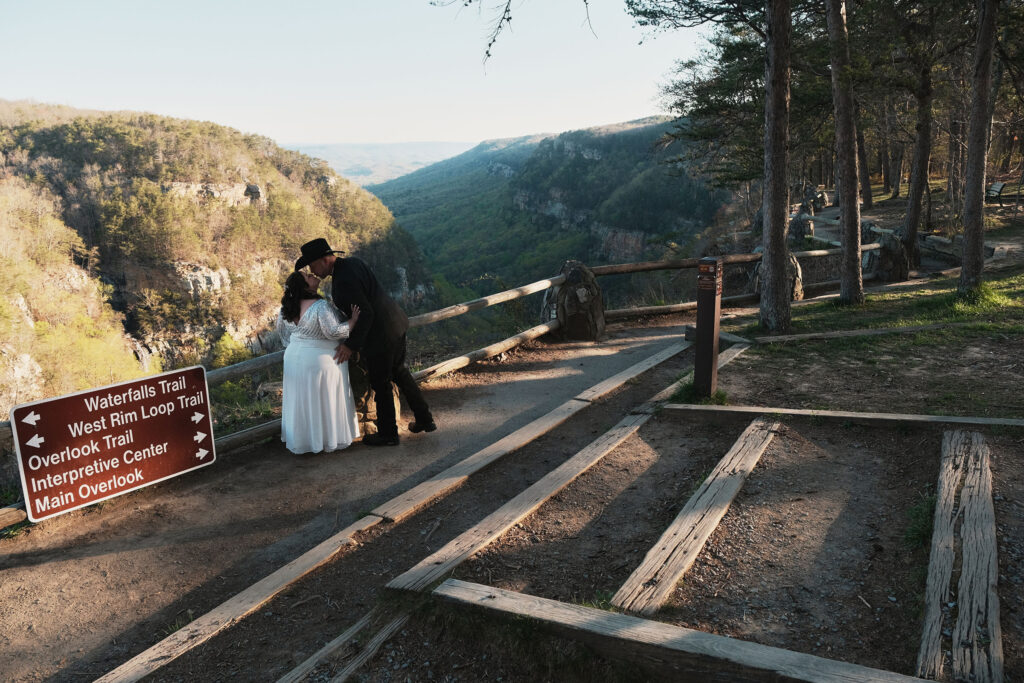 Couple kissing near sunrise at their Cloudland Canyon wedding