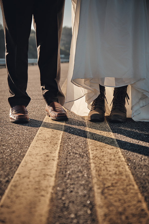 Bride wearing hiking boots under her dress