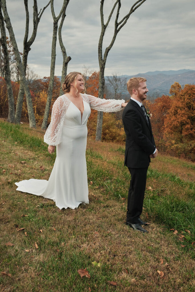 Bride taps on her groom's shoulder during their wedding day