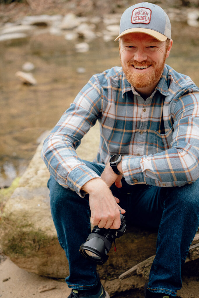 Lula Lake Elopement Photographer poses with camera
