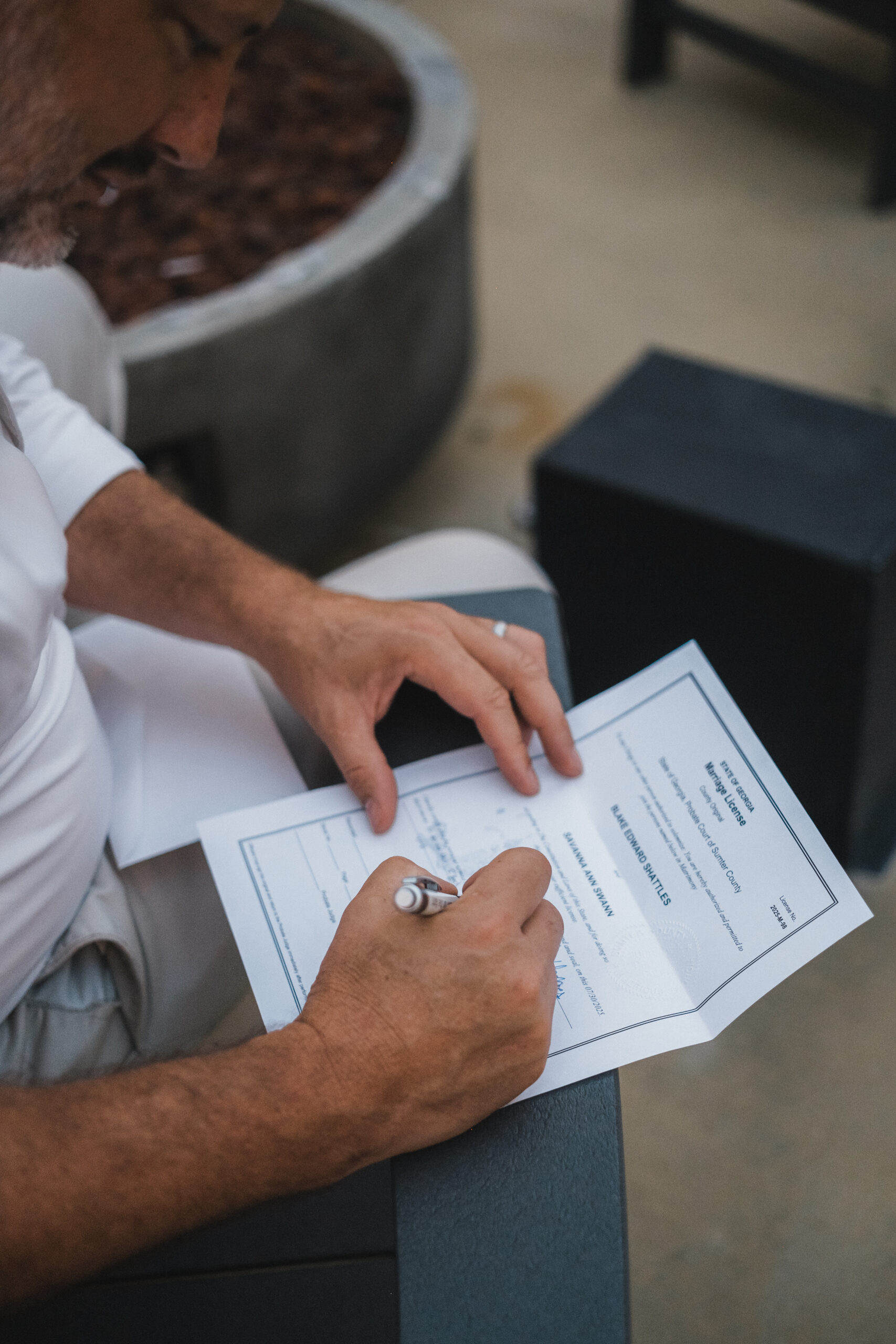 Marriage license being signed by officiant