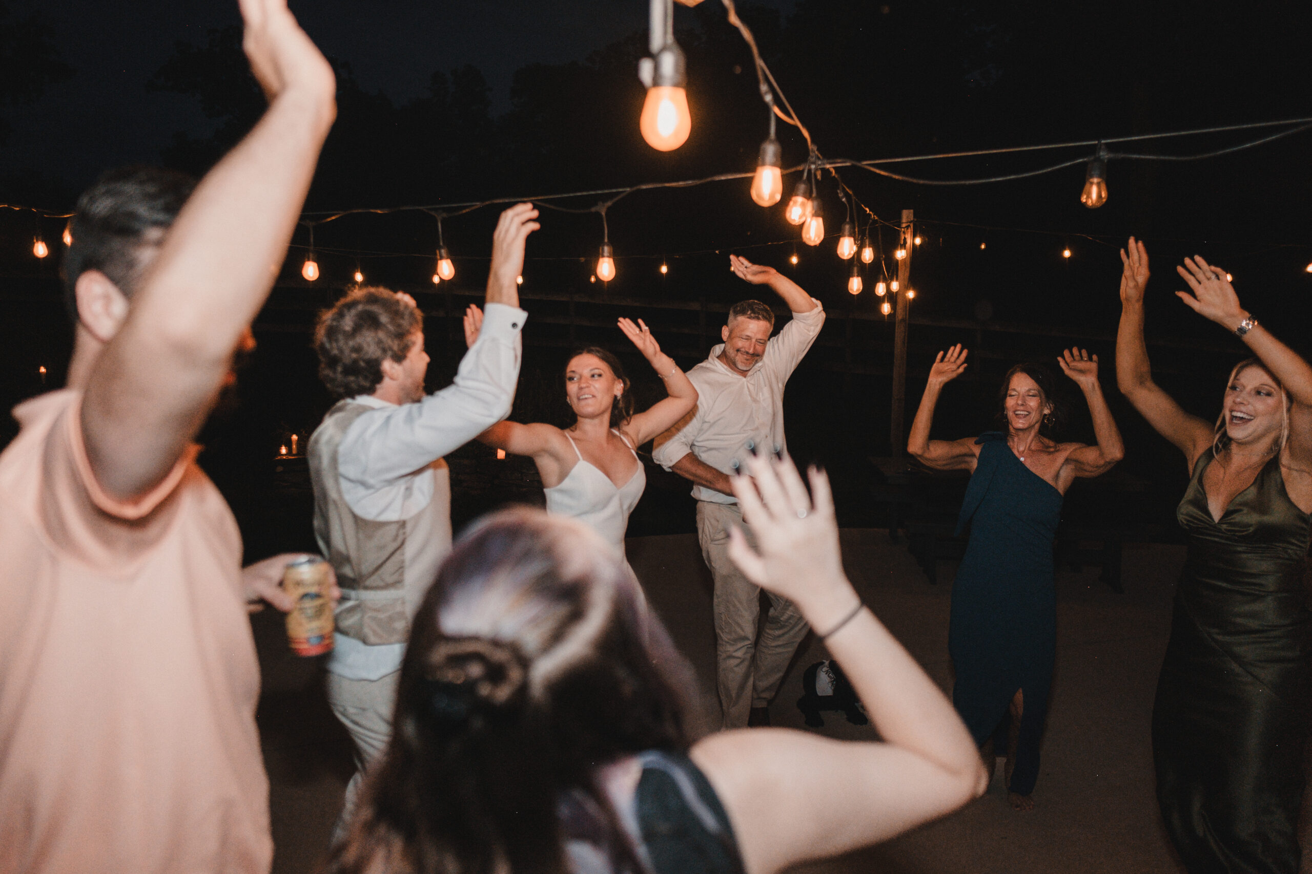 Intimate wedding reception with guests dancing